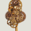 recto Broche Steampunk composée d'engrenages en alliage bronze Ornée d'un Grenat véritable et d'une agate de feu marron.